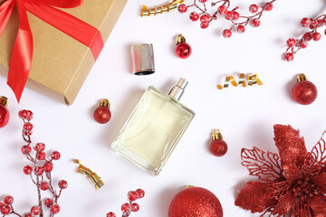 Wall Mural - Christmas composition with perfume bottle on white background, flat lay