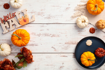 Wall Mural - Cozy home desk table with plaid, pumpkins, fall decor on wooden desk table. Flat lay, top view, copy space.
