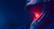 © Daria94 - A woman suffering from severe throat pain, highlighted by a glowing red area, symbolizing inflammation or illness, against a dark blue background.