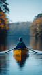 © rjankovsky - A man is rowing a yellow boat on a lake