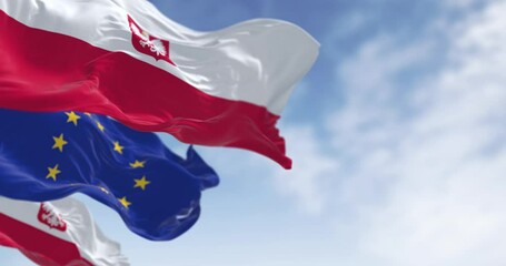 Wall Mural - Close-up of Poland national flag waving in the wind on a clear day