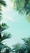© Diana - Flat lay frame with palm green leaves on sky background with copy space. desktop wallpaper with palm leaves. backdrop or green leafy tropical forest patterns for design elements.