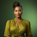 Elegant black woman with braided hair on green background