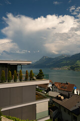 Wall Mural - Modern home exterior in nature. Modern home facade in Switzerland. Design ideal for living. Modern style home near Alps mountain. Real Estate of modern home with views of the mountains in the Alps.