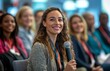 © yevgeniya131988 - A diverse audience listens to a woman speaking on marketing at a business conference