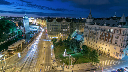 Canvas Print - Sitkovska water-tower night timelapse and traffic on road in old city center of Prague.