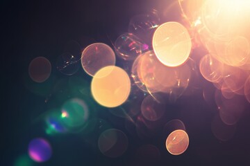 Poster - Colorful bokeh lights shimmer softly with warm hues against a dark background, creating a magical and dreamy atmosphere during nighttime
