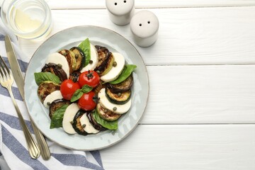 Poster - Tasty salad with grilled vegetables and mozzarella cheese served on white wooden table, flat lay. Space for text