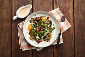 Wall Mural - Tasty salad with grilled vegetables served on wooden table, flat lay