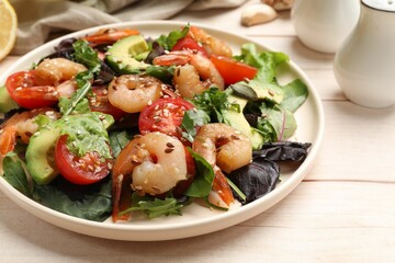 Delicious shrimp salad and ingredients on white wooden table, closeup