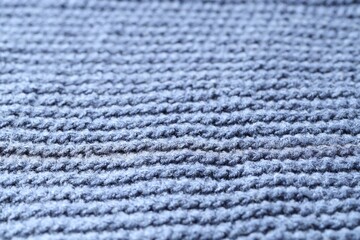 Poster - Texture of blue knitted fabric as background, closeup