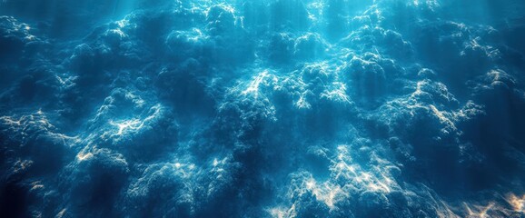 Wall Mural - Underwater view of the ocean floor, sunlight beams through the water, casting a beautiful and dreamy light on the seafloor.