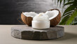 © hardvicore - Jar of coconut body butter on round stone podium. Organic beauty product. Natural cosmetics.