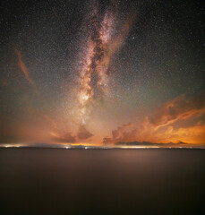 Wall Mural - beautiful night landscape, bright milky way galaxy over the lake, starry sky with long exposure clou