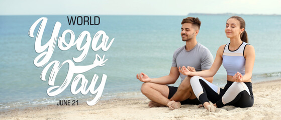 Wall Mural - Sporty couple practicing yoga on sea beach