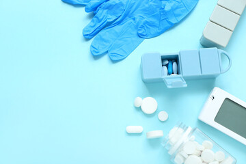 Sticker - Stethoscope, medical gloves, pillboxes and pills on blue background