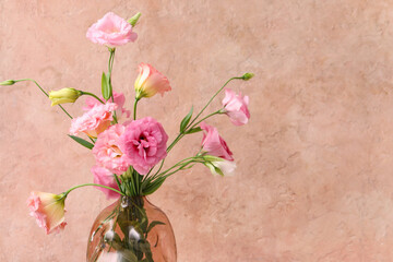 Wall Mural - Vase with beautiful pink eustoma flowers on light background