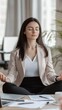 © Damerfie - Professional Woman Meditating in Office