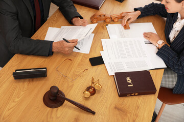 Canvas Print - Lawyers working with papers during meeting at table in office, top view