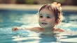 © Damerfie - Happy Toddler Swimming in Pool