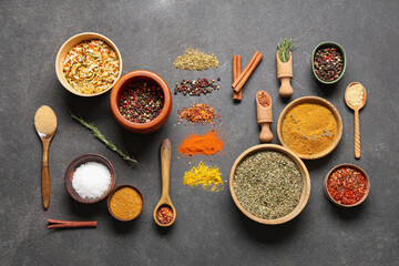 Beautiful composition with fresh aromatic spices on dark background