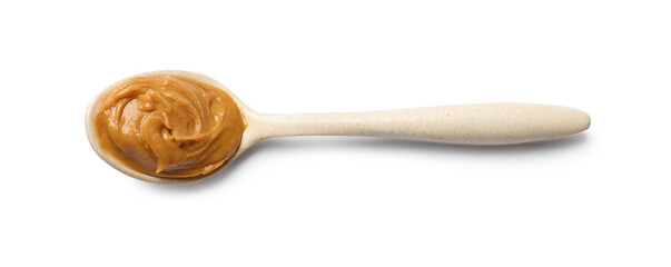 Wall Mural - Tasty peanut butter in spoon isolated on white, top view