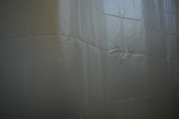 white plastic curtain texture in bathroom