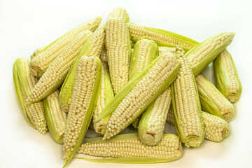 Wall Mural - Close-up of raw corns with skins with white background, South Korea