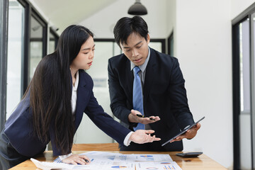 Business financial advisory services concept. Business teamwork and working on digital laptop computer with advisor showing plan of investment to clients at table office. Digital marketing.