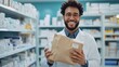 © thanarak - Smiling Pharmacist Holding Prescription Bag in Modern Pharmacy Interior