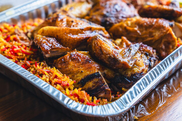 closeup of roasted chicken with spices in chicken kabsah, mandi rice