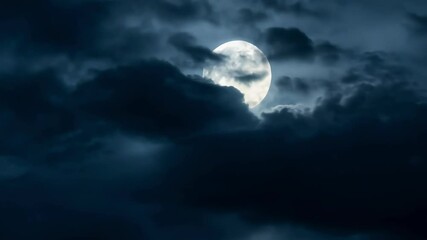 a night sky showcases a radiant full moon partially veiled by soft clouds. cool blue tones create a 