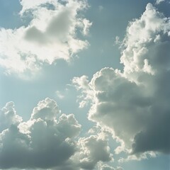 Wall Mural - A bright blue sky with puffy white clouds.