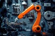 © igor - Orange robotic arm in industrial setting