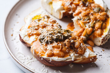 Wall Mural - Bagel with cream cheese and bean stew.