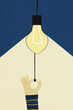 © Westend61 - Illustration of hand turning on light bulb