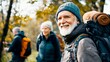 © KamokamoZa - Group of senior trekker walking in to the woods jungle. - Elderly people in the forest during hiking day.