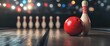 © pentolo - A red bowling ball and a white bowling pin with red stripes rest on a wooden lane, with a blurred background of other pins and lights.