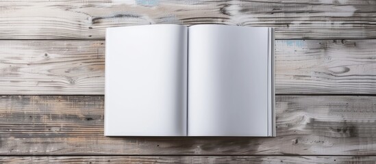 Canvas Print - A blank brochure mockup on a light wood background providing a template for design shown in an A4 magazine mockup on a gray table with a page or notepad ideal for a copy space image