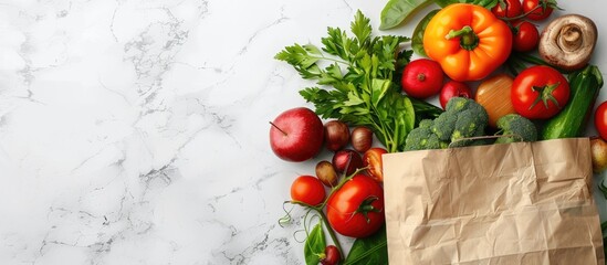 Poster - Fresh fruits and vegetables in a paper bag showcased on a white marble backdrop in a flat lay style perfect for adding text to the copy space image