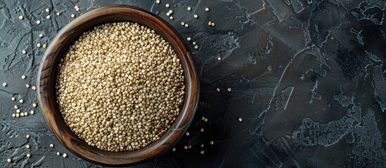 Aufkleber - Wooden bowl filled with raw organic quinoa top view for text in the copy space image