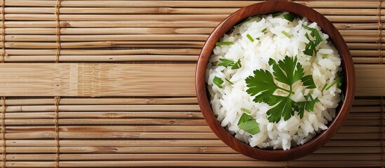 Aufkleber - Top view of appetizing boiled rice bowls garnished with parsley on a bamboo mat suitable for adding text in the copy space image