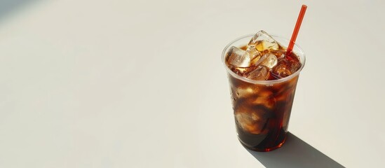 Poster - White background enhances isolation concept with Americano ice coffee featuring copy space image