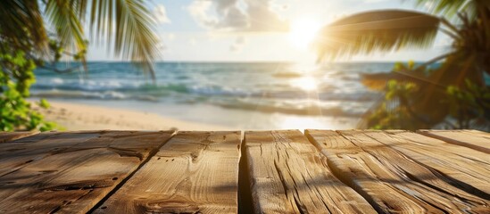 Poster - Wooden table featuring a sunny tropical beach background blurred to enhance focus ideal for showcasing summer products and presentations with copy space image