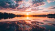 © Charoen - Stunning sunset over a calm lake with reflection.
