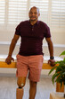 © Wavebreak Media - Man with prosthetic leg standing confidently in modern prosthetic medical clinic