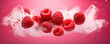 © Alena - Fresh raspberries flying in the air with splashes in red pink color background. Raspberry concept.