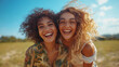 © Paradoxx - two womenTwo happy women with curly hair and glasses smiling in a field. Suitable for lifestyle, happiness, friendship, and diverse concepts. Generative AI