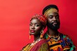 © Anna - Couple in traditional African attire on red backdrop