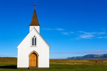 Small White Church with Wooden Door and Cross on a Bright Sunny Day, Set Against a Vibrant Blue Sky and Green Landscape